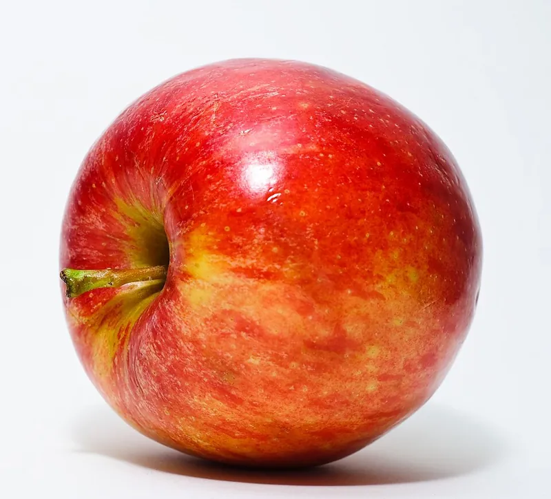 A single ripe red apple